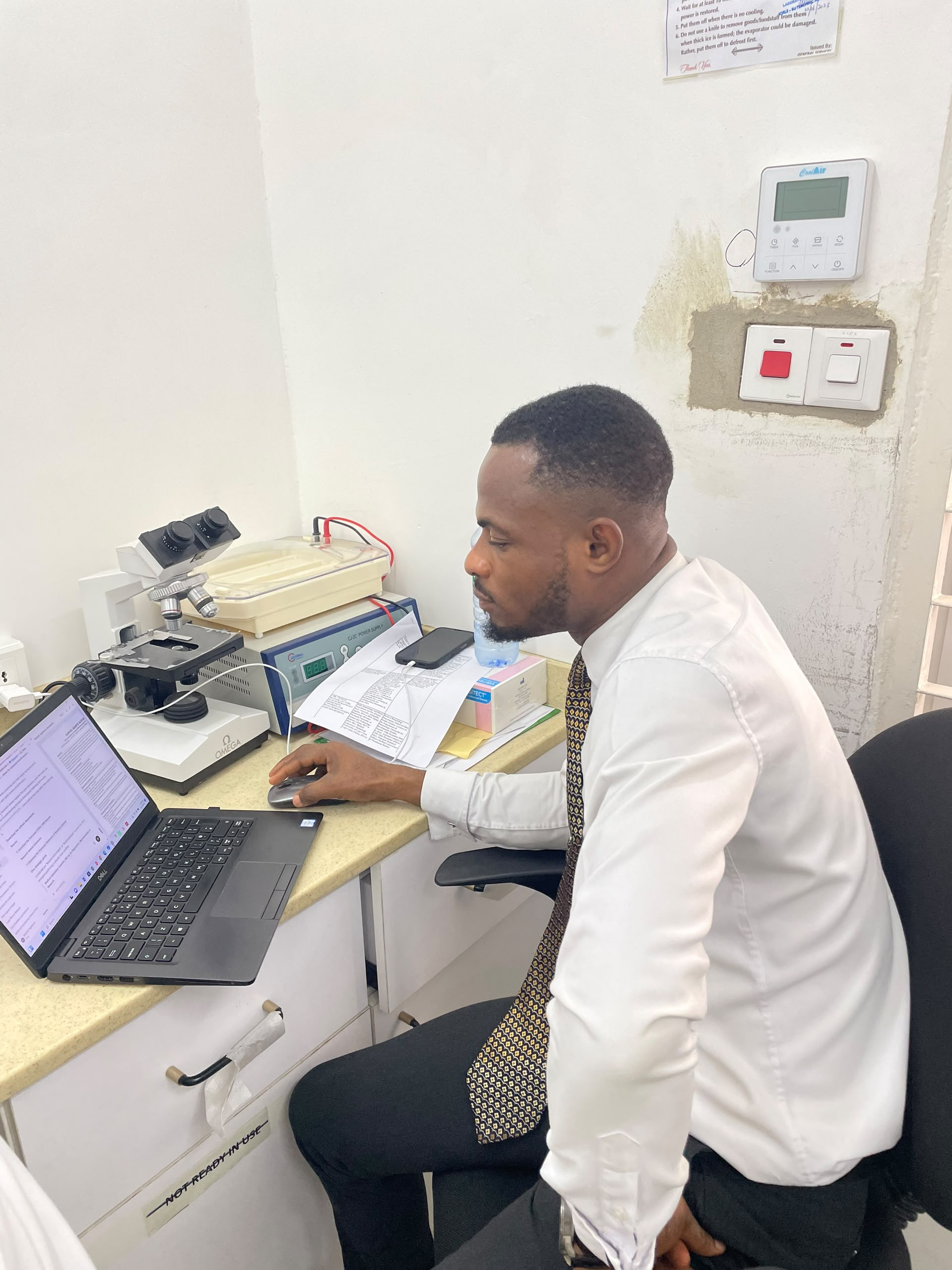 First Class Laboratory staff member reviewing laboratory work